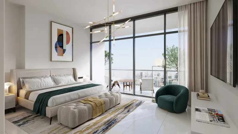 Bedroom with a balcony and full-height windows in an Al Habtoor Tower apartment