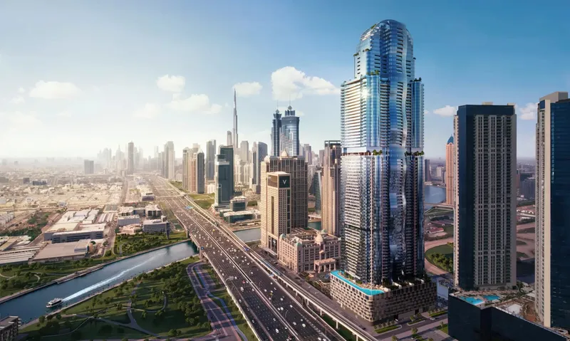 Aerial view of Al Habtoor Tower rising above Sheikh Zayed Road with the Downtown Dubai skyline behind