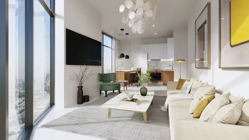 Living room with floor-to-ceiling windows and an open kitchen in an Al Habtoor Tower apartment