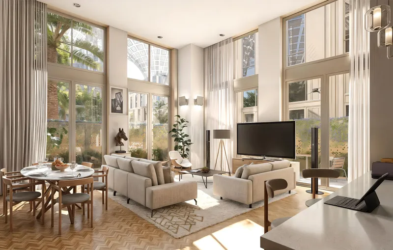 Render of a double-height living room at Al Waha Residences with full-height windows