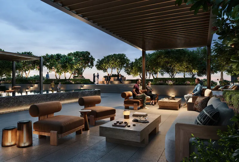 Render of the shaded outdoor multipurpose zone at Albero with lounge seating in the evening