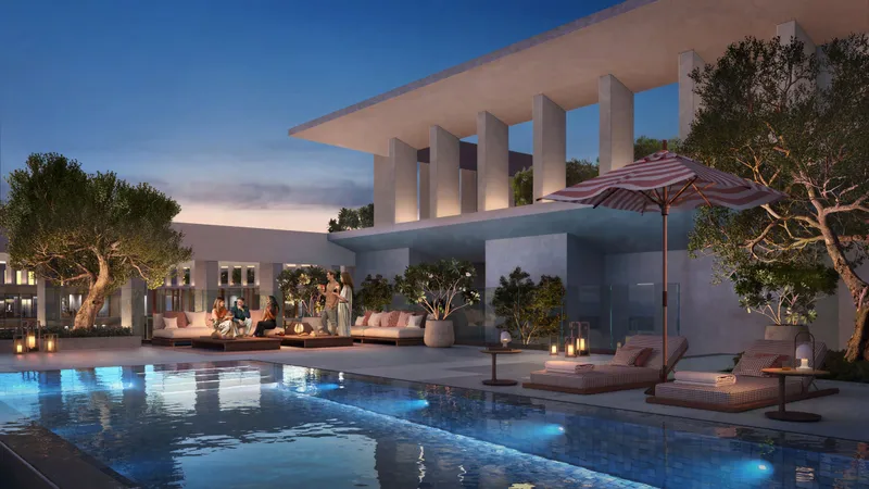 Render of a pool deck at Alder in the evening, with lounge seating and parasols