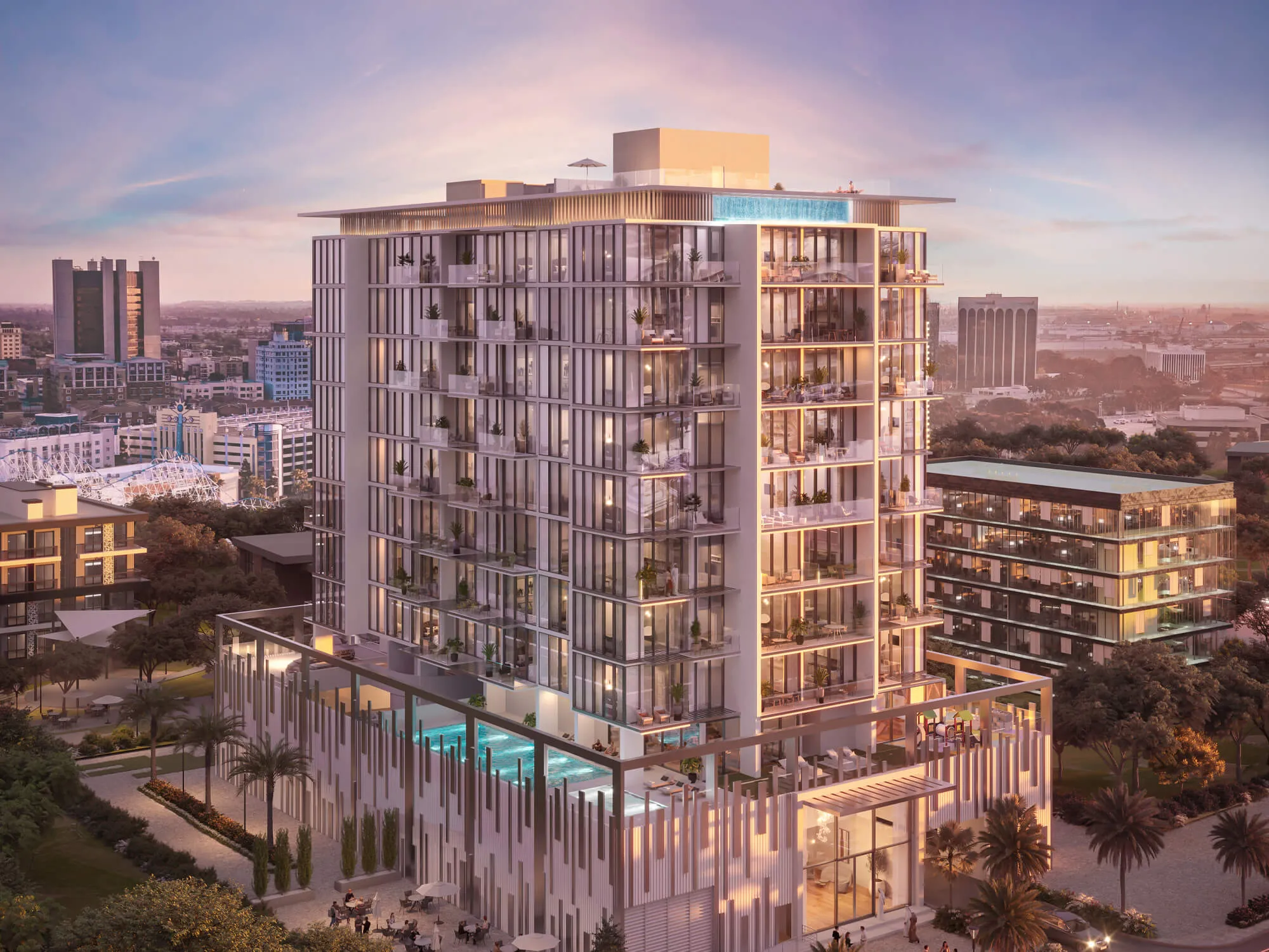 Aerial dusk view of the Allegro Residences building with a podium pool and lit apartments