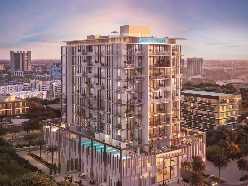 Aerial dusk view of the Allegro Residences building with a podium pool and lit apartments