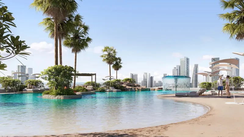 Sandy beach edge of the lagoon pool at ALTA V1EW Skyhomes