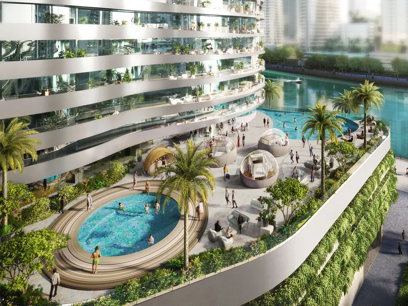 Podium pool deck at Altitude de GRISOGONO with a circular pool, seating pods and palm trees