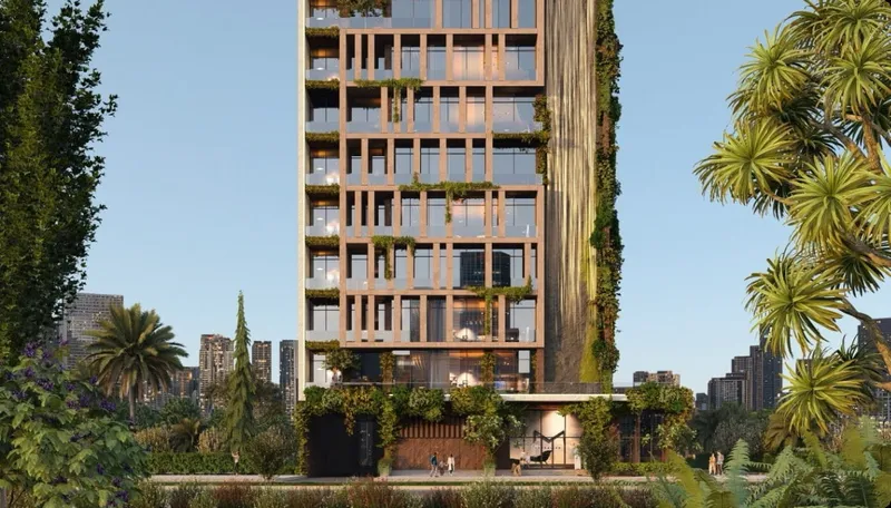 Amazonia seen from street level, a 12-storey building with planted balconies between palm trees