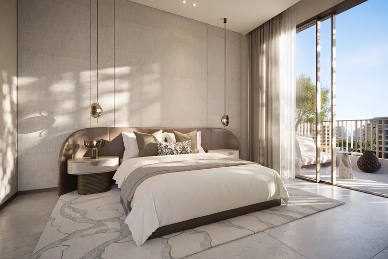 Main bedroom with full-height glazing opening onto a terrace at Arancia Yards