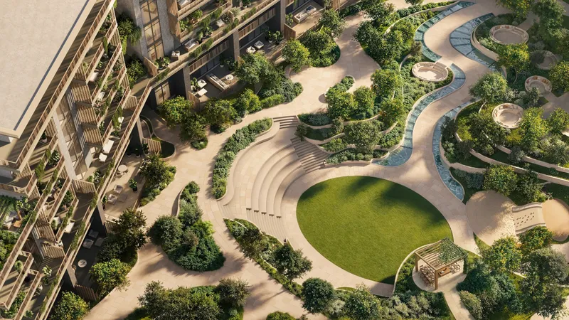 Elevated view of the Arancia Yards sunken garden with a central lawn, stepped seating and winding paths