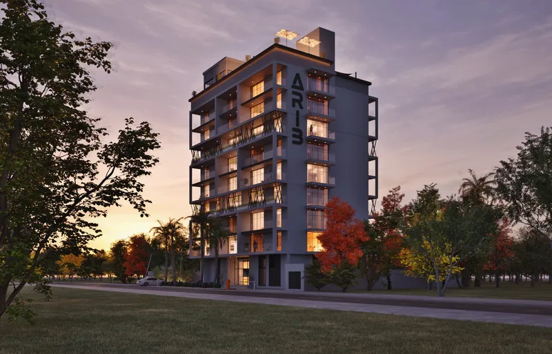 ARIB Collection apartment building in Dubailand Residence Complex at dusk