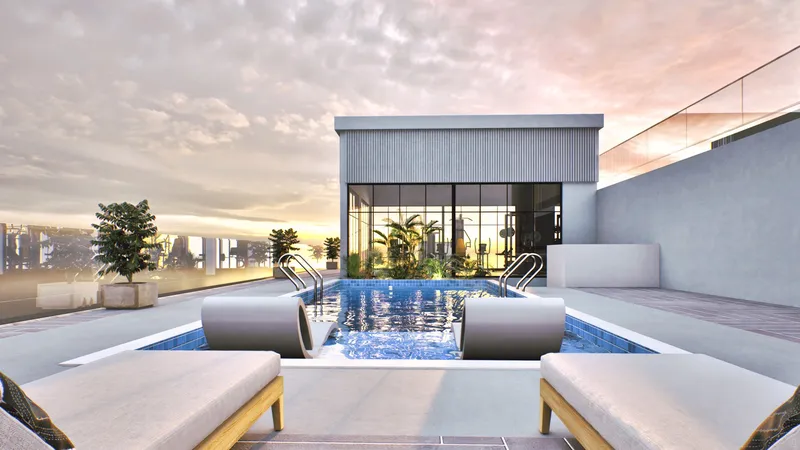 Rooftop pool with sun loungers and a glazed pavilion at ARIB Collection