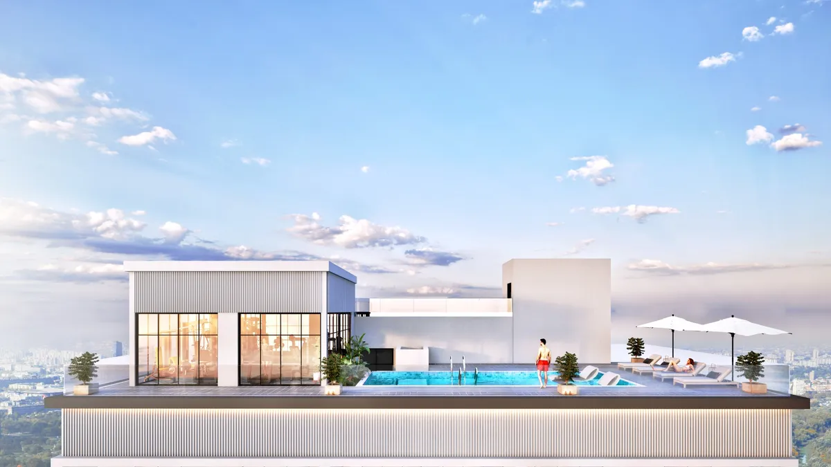 Rooftop pool at ARIB Collection with the Dubai skyline in the distance