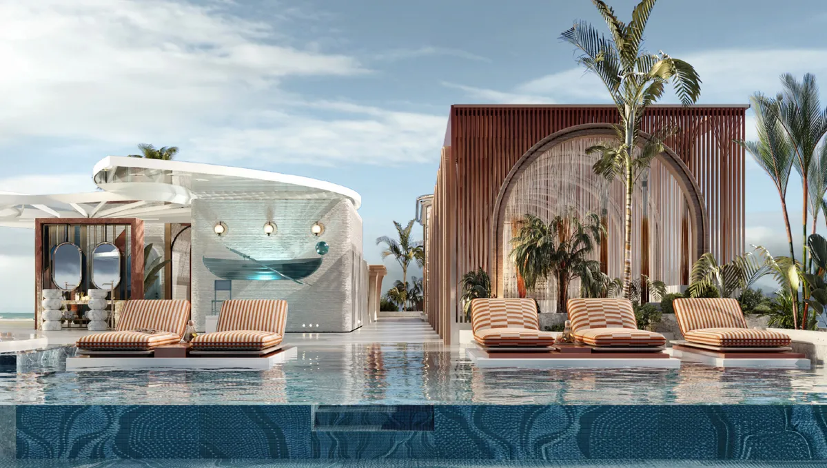 Rooftop infinity pool with sunbeds and cabanas at ARYA Residences