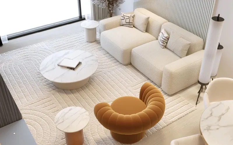 Interior render of an Auresta Tower living room with a cream sofa and marble tables