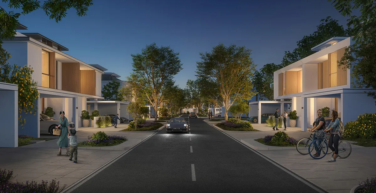 Render of a street of Avena 2 villas at dusk with covered parking and street trees