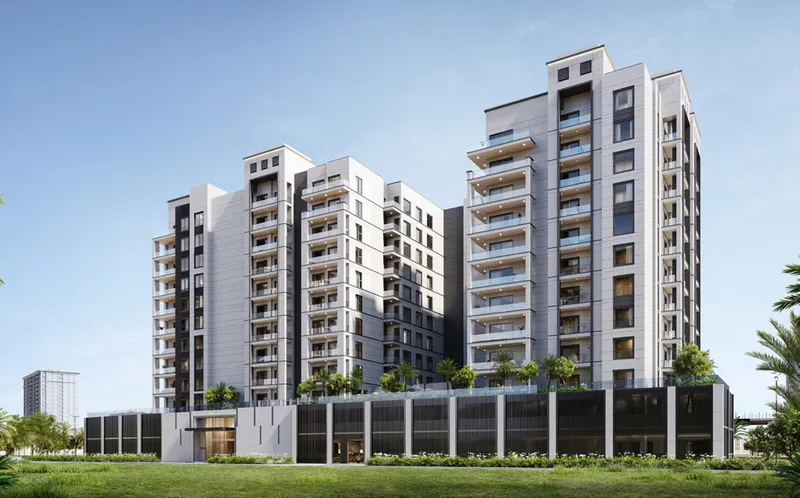 Render of Avenue Residence 7 in Al Furjan seen from the side, showing the residential floors above the parking podium