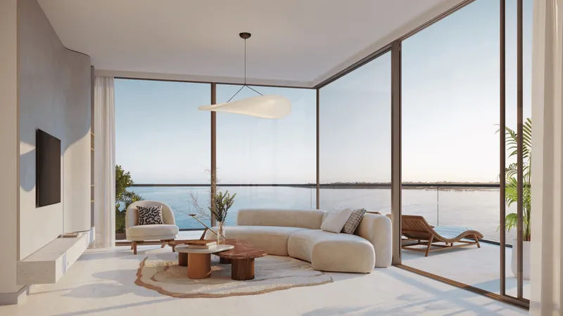 Render of a living room at AYA with floor-to-ceiling windows and a terrace over the water