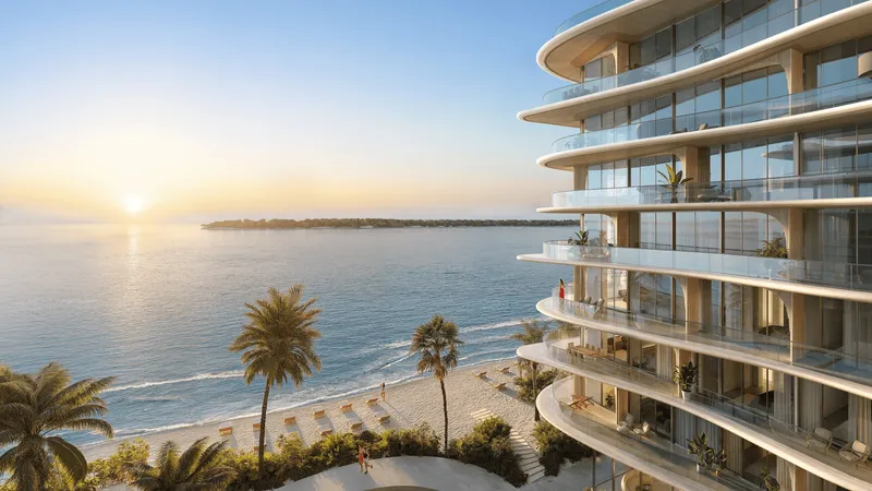 Render of the curved terraces of AYA Beachfront Residences overlooking the beach and the Arabian Gulf at sunrise