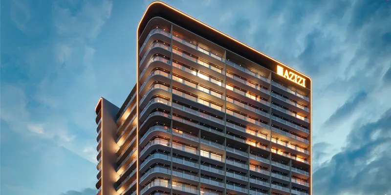 Render of the upper floors of Azizi Arian lit in the evening