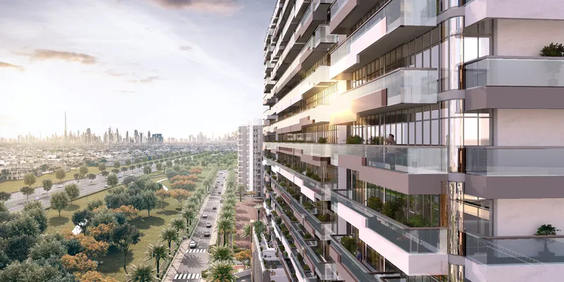 Render of the full-length balconies on the Azizi Grand facade with the Dubai skyline in the distance