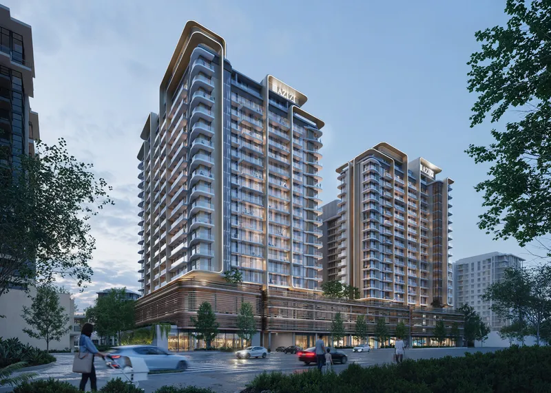 Render of the two Azizi Jaddaf Beach Oasis buildings in Al Jaddaf seen from the street at dusk