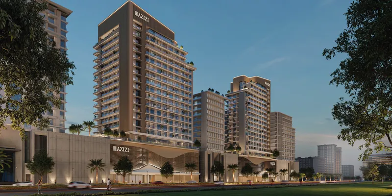 Render of Azizi's Al Jaddaf towers lit at dusk