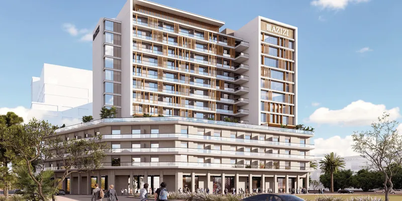 Render of the Azizi Lina apartment building in Downtown Jebel Ali with shops along the street