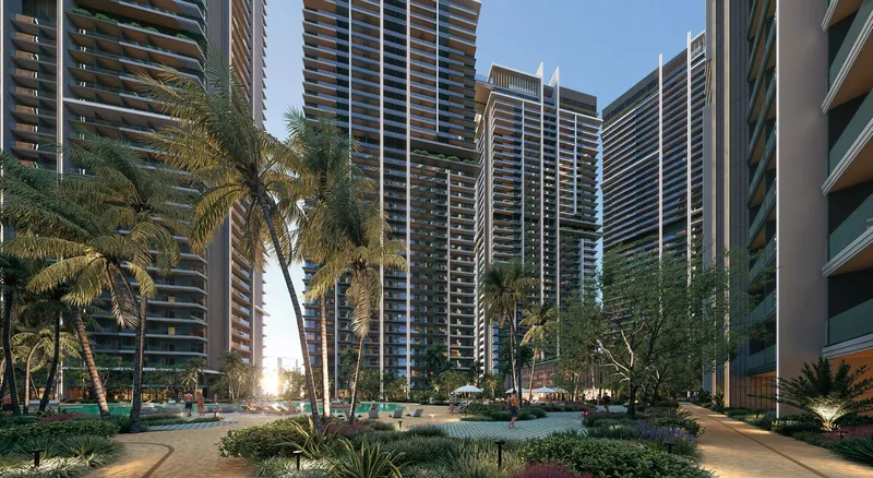 Render of palm-lined gardens and walkways between the Azizi Milan Heights towers at sunset