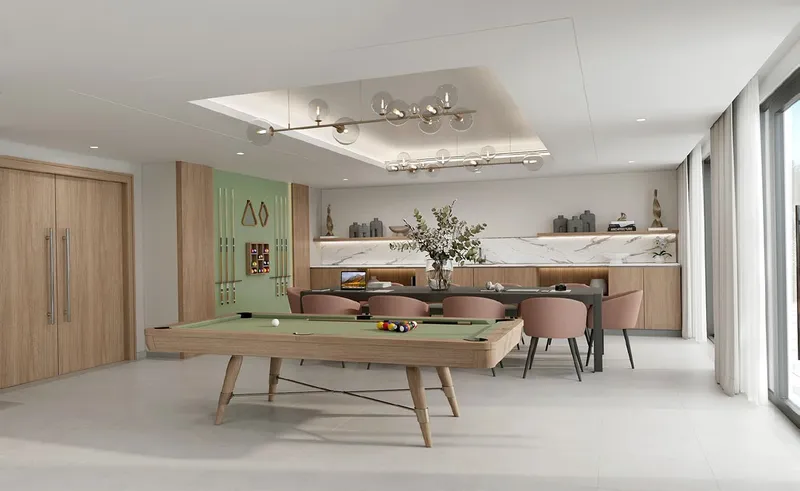 Render of the clubhouse with a pool table at Azizi Ruby
