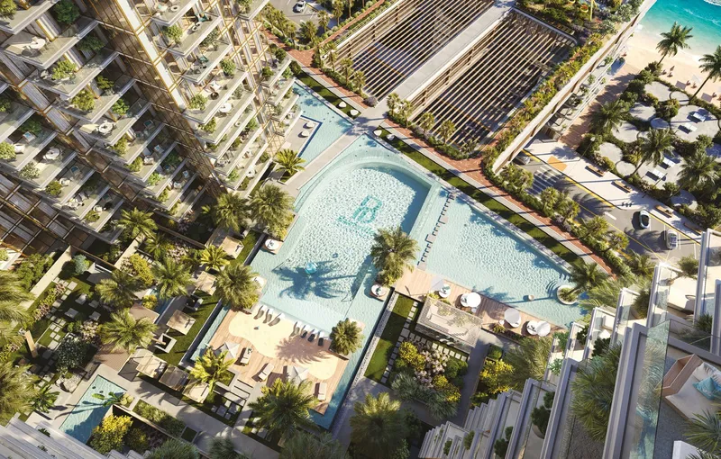 Aerial render of the landscaped resort podium and pools between the towers