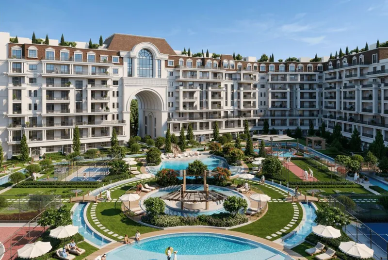 Render of the central courtyard of Bab Al Qasr Garden Residence 65, with pools, lawns and a fountain framed by European-style buildings