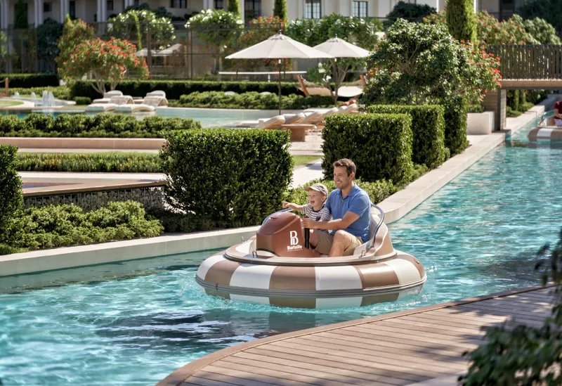 Render of residents in a paddle boat on the landscaped canal