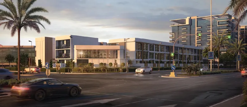 Street view of the Baia townhouses at dusk from Al Raha Boulevard (developer render)