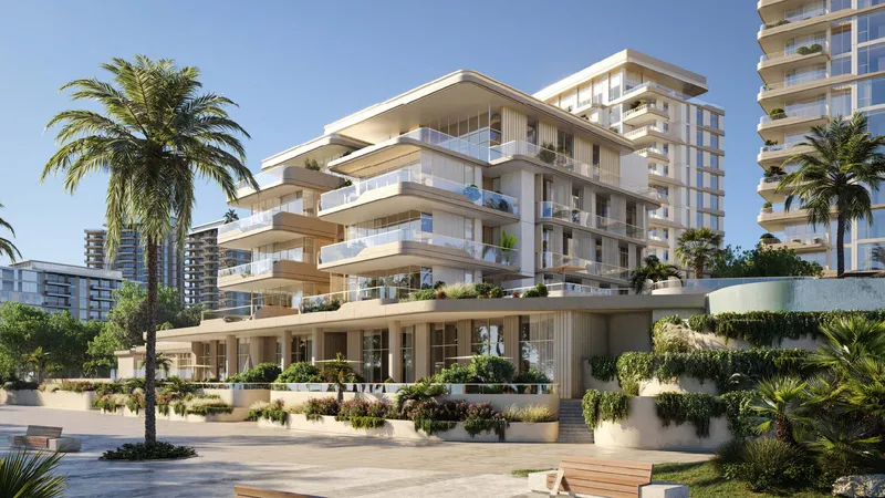 Low-rise Bay Grove Residences building with curved balconies, palms and a landscaped arrival area