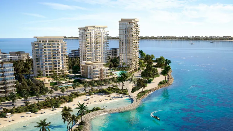 Aerial view of the final-phase buildings of Bay Grove Residences at the end of the bay