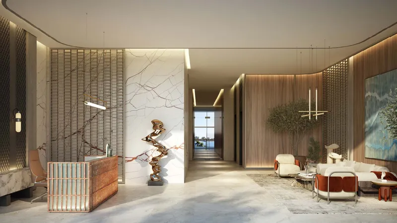 Residents' lobby at Bay Grove Residences with stone walls and a reception desk