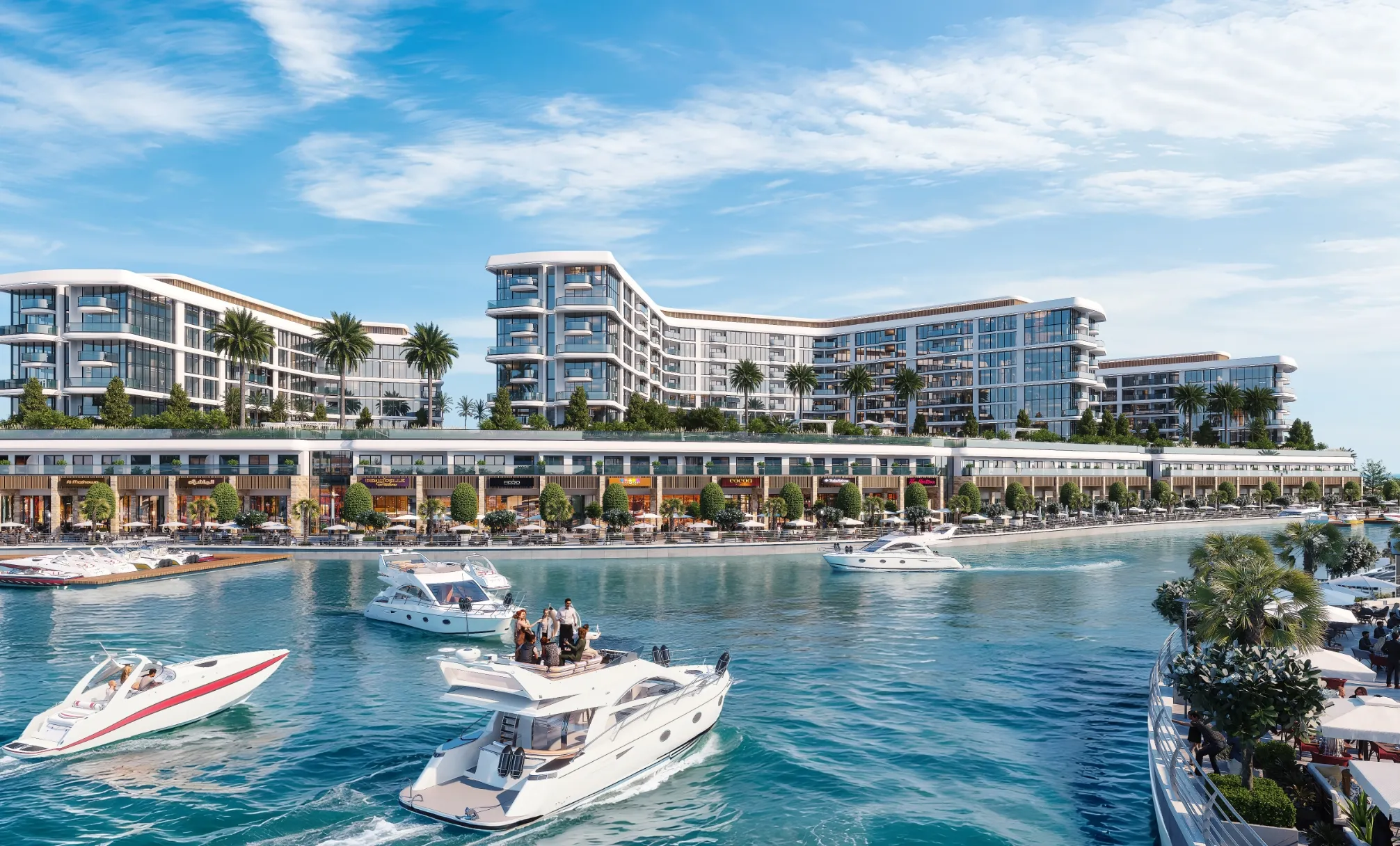 Marina Residences buildings seen across the water on Sobha Siniya Island, with yachts in the foreground