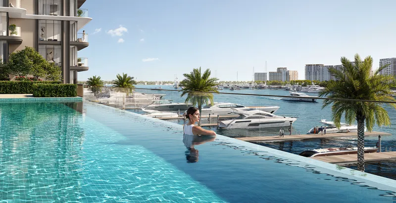 Render of the Baystar by Vida infinity pool with the tower behind and yachts berthed in the marina