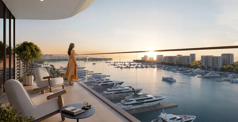 Render of a resident on a Baystar by Vida terrace looking over the marina at sunset