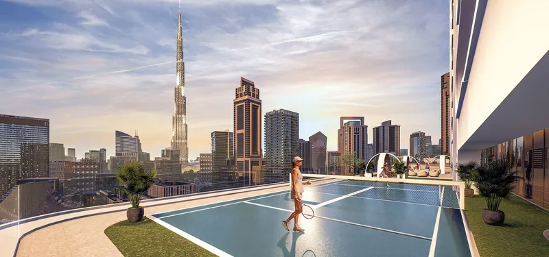 Podium tennis court at Bayz 101 by Danube with Burj Khalifa behind
