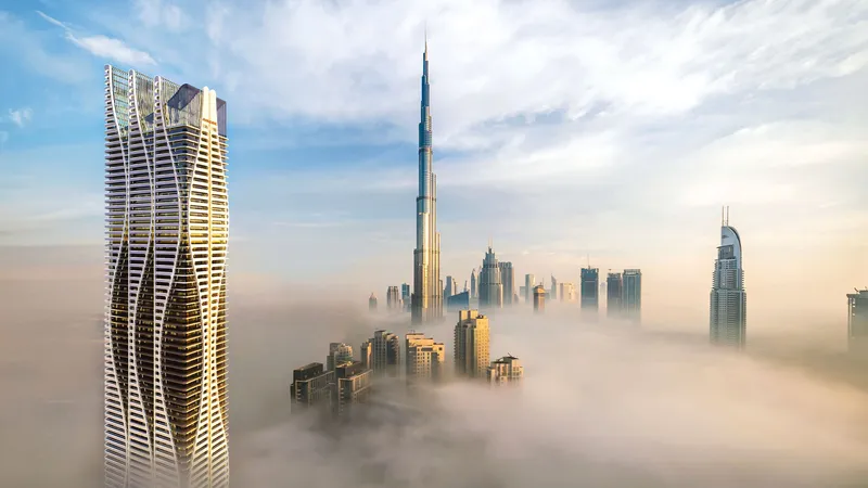 Bayz 101 by Danube tower rising above the clouds beside Burj Khalifa