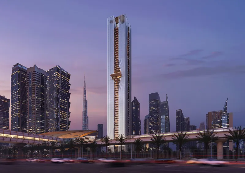 Render of Berkeley Tower at dusk rising above Sheikh Zayed Road and the Dubai Metro line, its pleated façade lit from within