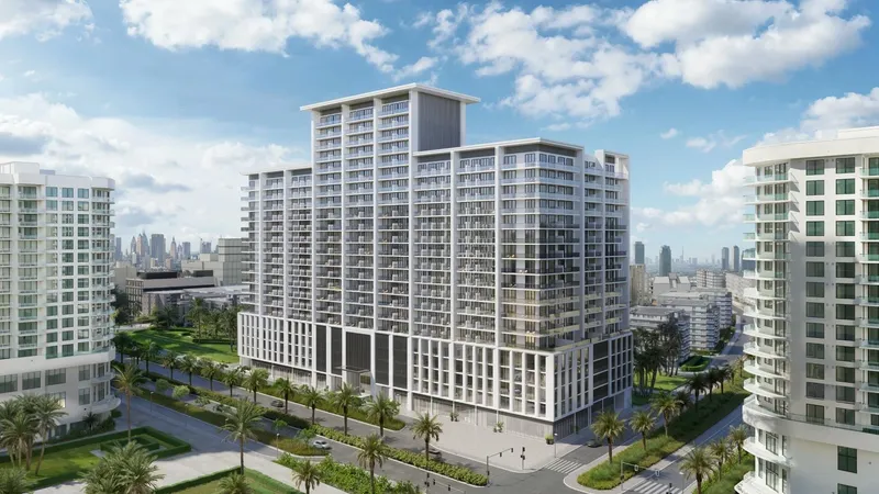 Daytime render of Binghatti Amberhall, a stepped white apartment building in Jumeirah Village Circle