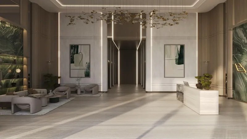 Render of the Binghatti Amberhall lobby with a reception desk, lounge seating and a sculptural ceiling light