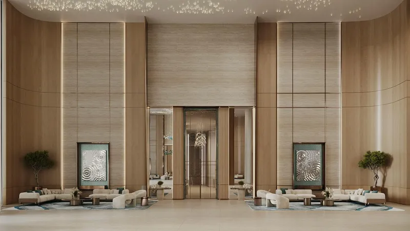 Render of the double-height Binghatti Aquarise lobby with timber wall panels and lounge seating