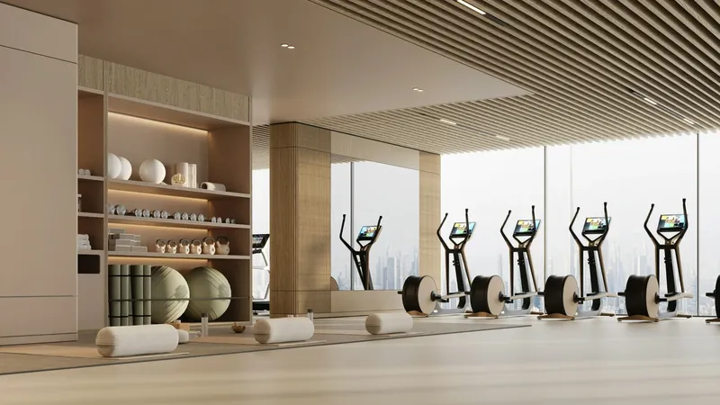 Render of the gym at Binghatti Cullinan with cardio machines facing full-height windows