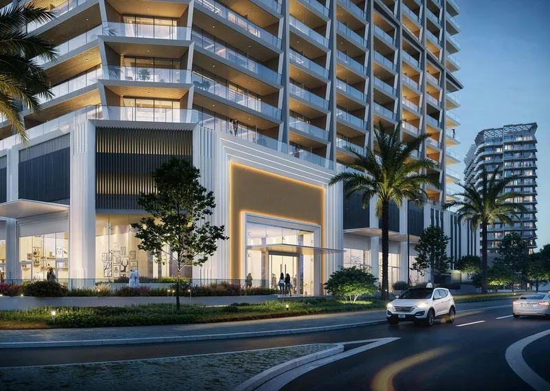 Render of the street-level entrance and ground-floor shops at Binghatti Ghost in the evening