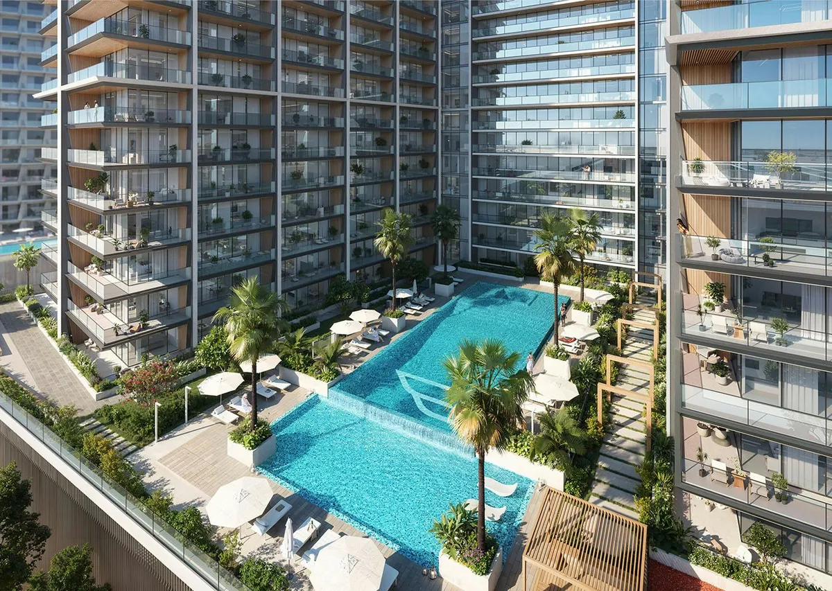 Render of the podium pool deck at Binghatti Ghost, with sun loungers, palms and balconies above