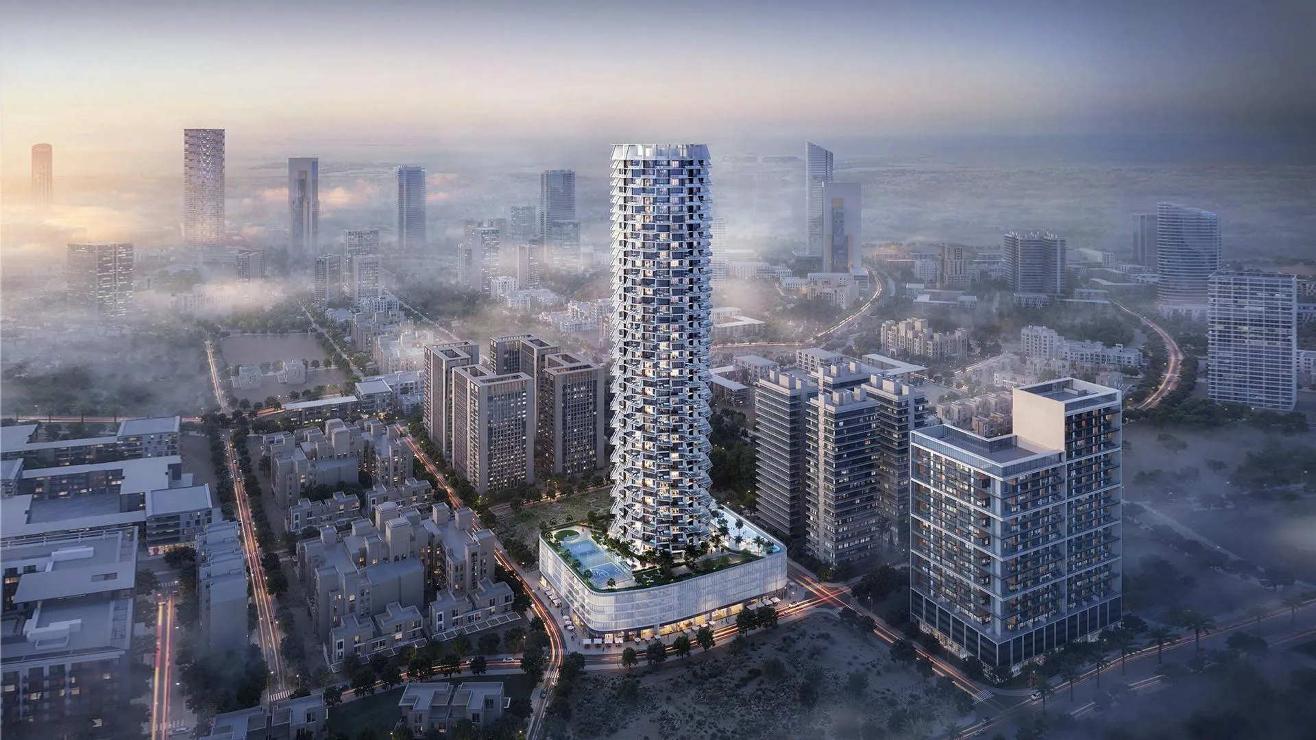 Computer-generated aerial render of the Binghatti Grove tower rising above Jumeirah Village Circle in morning haze