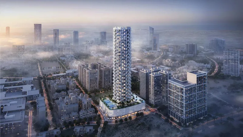 Computer-generated aerial render of the Binghatti Grove tower rising above Jumeirah Village Circle in morning haze